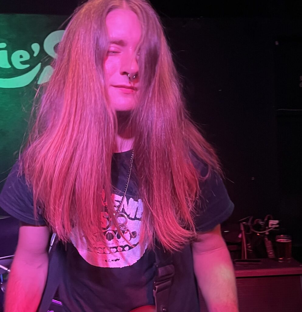 Michael Jan playing his bass.